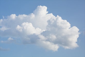Cumulus clouds against blue sky