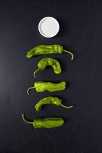 Green Shishito Peppers and salt in ramekin
