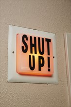 Shut up sign in radio broadcast booth