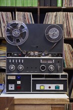 Collection of vinyl LP records and tape recorder