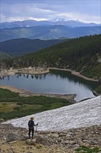 USA, Colorado, Idaho Springs, Hiker looking at view from Saint Mary's Glacier