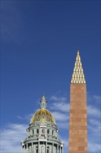USA, Colorado, Denver, Capitol State building and Veterans monument against blue sky