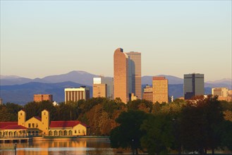 USA, Colorado, Denver, City Park with buildings in background at dawn
