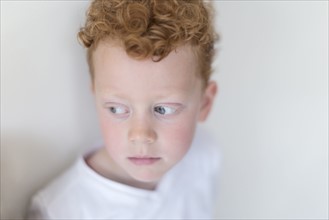 Portrait of boy (8-9) with red hair