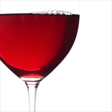 Close-up view of glass of red wine.