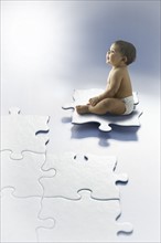 Baby girl (6-11 months) sitting on puzzle piece.