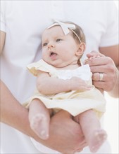 Studio shot portrait of baby girl (2-5 months) with father