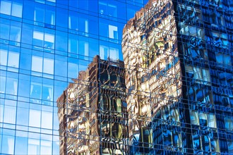 USA, New York, Distorted reflections in glass building