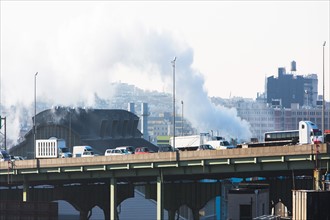 USA, New York, New York City, Smoke over bridge