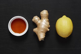 Bowl with honey, ginger and lemon