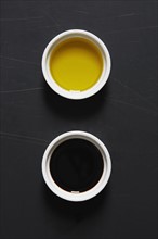 Olive oil and vinegar in bowls
