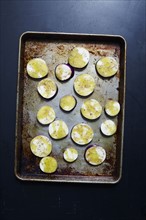 Sliced eggplant in baking sheet