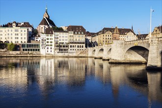 Switzerland, Basel, Basel-Stadt, Houses by Rhine River and stone bridge