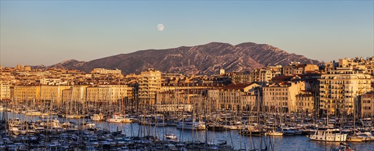 France, Provence-Alpes-Cote d'Azur, Marseille, Cityscape with Vieux port - Old Port, mountain in background