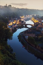 France, Brittany, Dinan, Cityscape with river at dawn