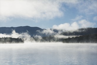 USA, New York State, Fog above Lake Placid
