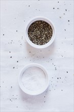 Salt and pepper on marble counter
