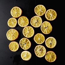 Dried lemon slices on black background
