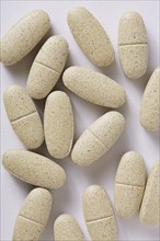 Vitamin supplements on white background