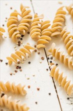 Pasta and quinoa on white background