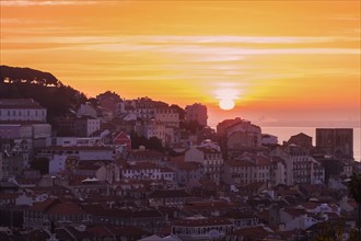 Portugal, Lisbon, Sun rising above Old Town of Lisbon