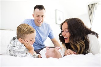 Parents son (4-5) and daughter ( 1 month) in bedroom