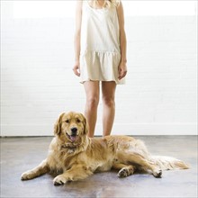 Young woman with golden retriever