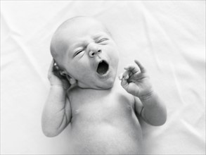 Portrait of newborn boy ( 0-1 months ) yawning