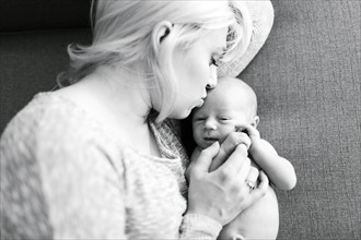 Portrait of newborn boy ( 0-1 months ) with mother