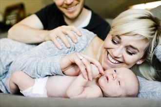 Portrait of parents with newborn boy ( 0-1 months )