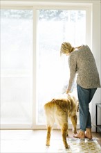 Woman at home with dog