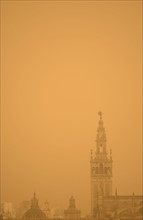 Spain, Seville, Giralda at foggy day