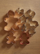 Studio shot of cookie cutters on wooden table