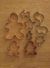 Studio shot of cookie cutters on wooden table