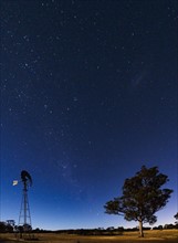 Australia, Canberra, Starry sky over rural landscape