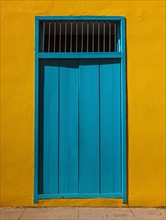 Cuba, Havana, Building exterior with blue door