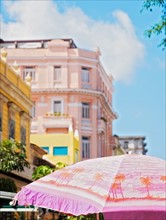 Cuba, Havana, Colonial architecture and sunshade in foreground