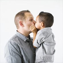 Father kissing son (2-3)