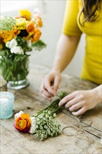 Woman preparing bouquet