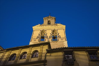 Spain, Seville, Facade of San Juan De La Palma Church at dusk