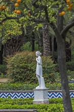 Spain, Seville, Maria Luisa Park, Female statue in park