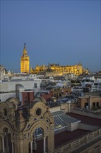 Spain, Seville, Cityscape with Cathedral of Seville at sunset