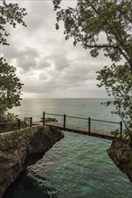 Jamaica, Negril, Footbridge hanging between rocks