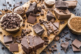 Various chocolate pieces on cutting board