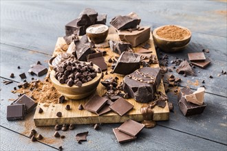 Various chocolate pieces on cutting board