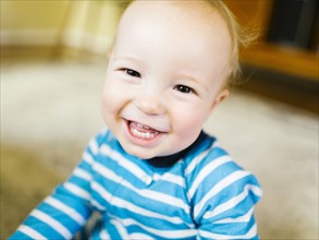Portrait of baby boy (12-17 months) smiling