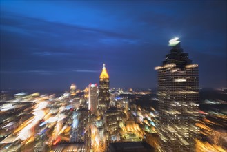 USA, Georgia, Atlanta, Blurred motion of cityscape at dusk