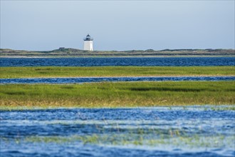 USA, Massachusetts, Cape Cod, Provincetown, Bay of water with lighthouse