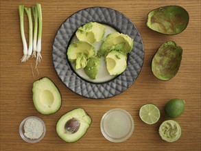 Studio shot of avocado, lime and scallion for guacamole