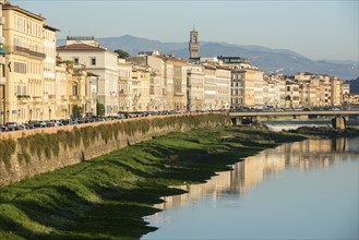 Italy, Tuscany, Florence, Cityscape reflected in Arno River